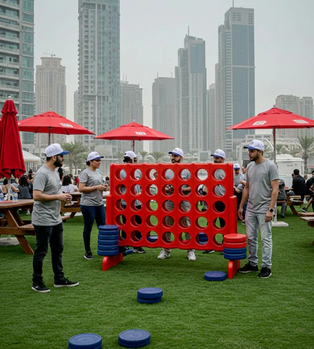 Ultimate Tailgate Throwdown team-building activity in Dubai with employees playing a giant Connect Four game, enhancing teamwork, strategy, and problem-solving skills