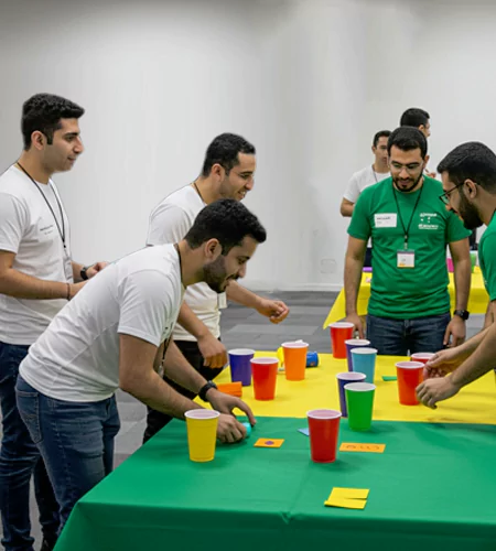 Win It in a Minute team-building activity in Dubai with employees competing in fast-paced challenges, promoting teamwork, agility, and problem-solving skills