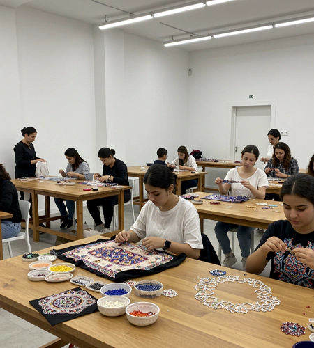 "Corporate team members blending scents during a perfume-making workshop in Dubai, designed as a sensory art experience for corporate events planners. "