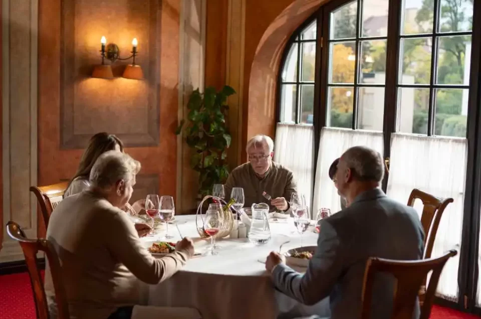 Couple dining in an upscale restaurant with elegant decor, representing MRM Events' premium private dining experiences.