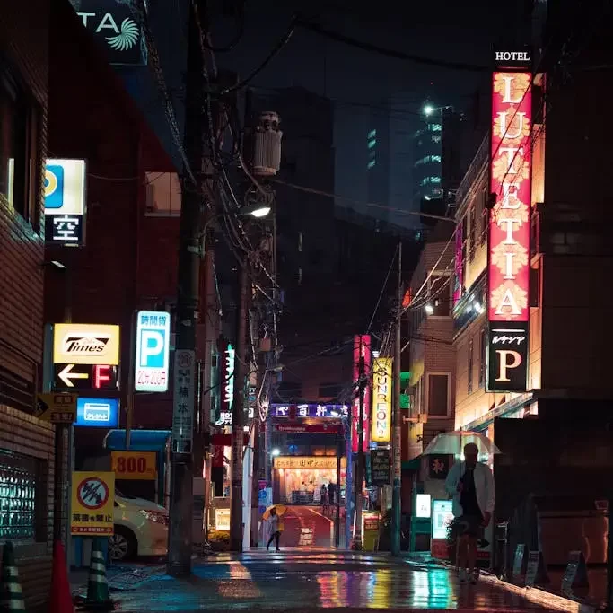 Vibrant urban scene with digital billboards and skyscrapers at night, illustrating dynamic city venue possibilities with MRM Events.