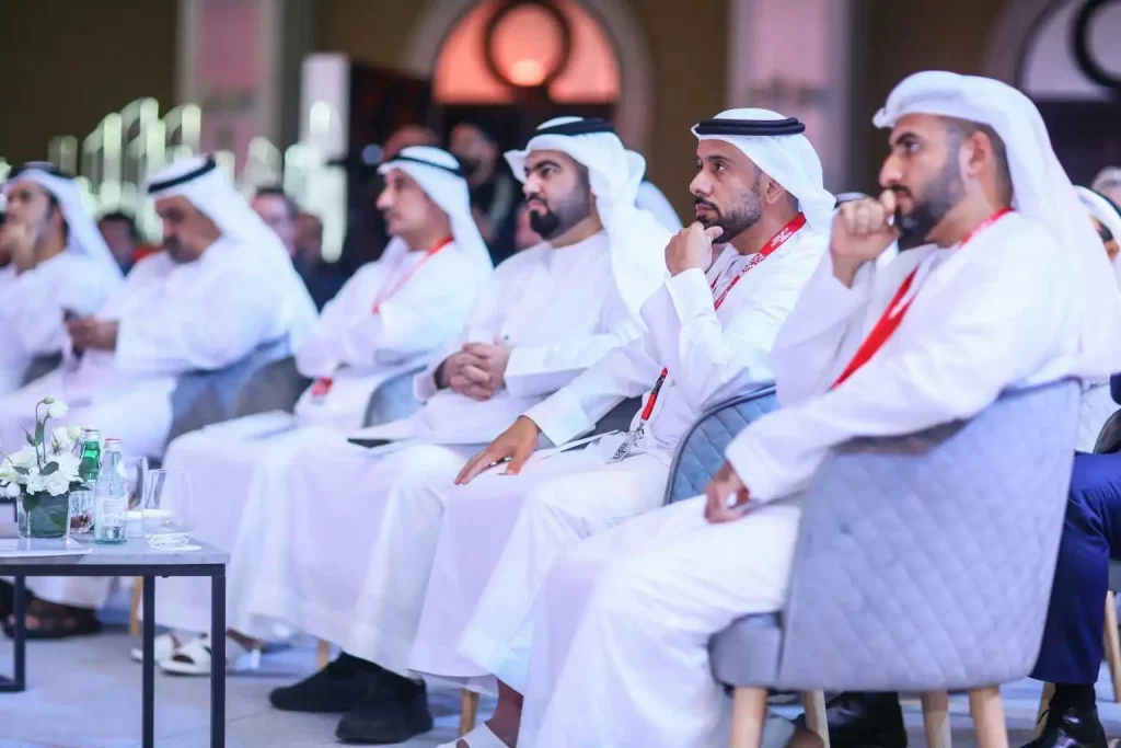 Men in traditional Emirati attire at a formal conference, representing MRM Events' business events.