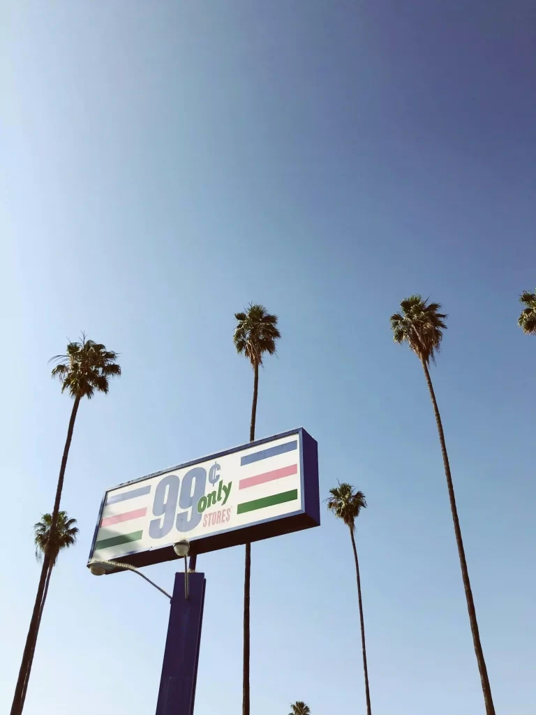 Signpost covered in snow with arrows pointing to various cities, symbolising worldwide reach and travel events managed by MRM Events.