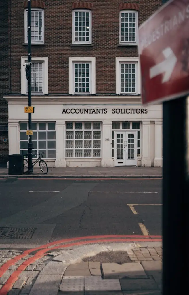 Overhead view of coworkers working on laptops with coffee cups and notebooks, reflecting collaborative event planning by MRM Events.