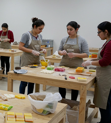 "Participants crafting colorful soaps during a hands-on art workshop in Dubai, held for creative expression and corporate team-building events. "
