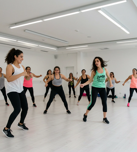 "Corporate Zumba session during wellness workshops in Dubai, promoting fitness and team energy through fun movement for corporate events. "
