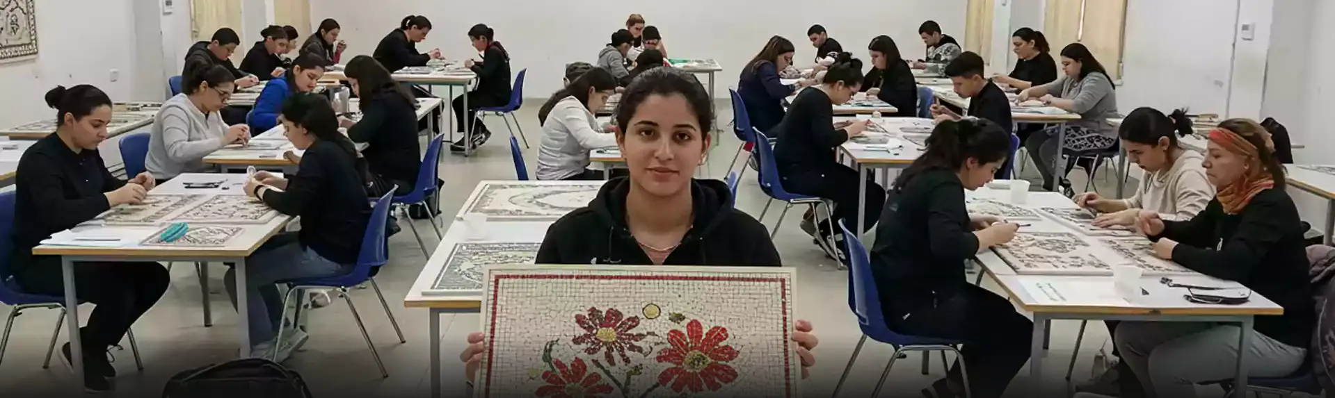 Corporate professionals enjoying an art workshop in Dubai, painting vibrant designs on canvas and exploring creativity in a corporate setting