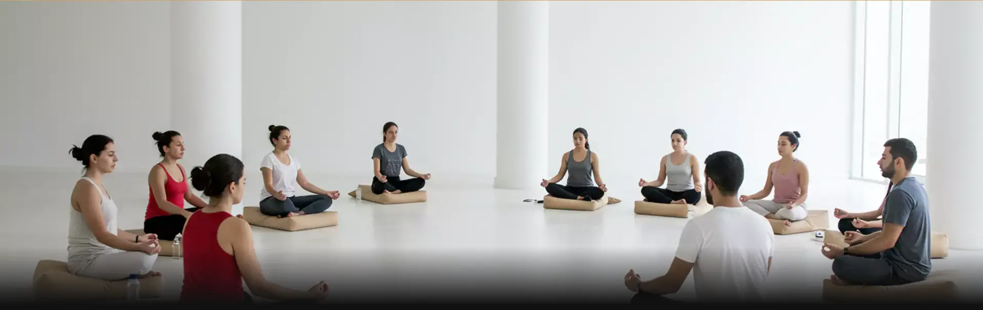 Corporate professionals practicing mindfulness in an outdoor wellness workshop in Dubai, engaging in guided meditation for relaxation and well-being