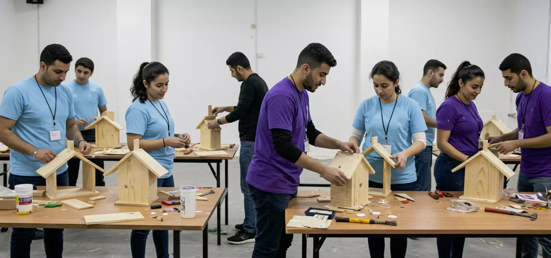 Indoor team-building activity in Dubai with employees engaged in a giant Jenga challenge, promoting teamwork, strategic thinking, and collaboration in a fun setting.