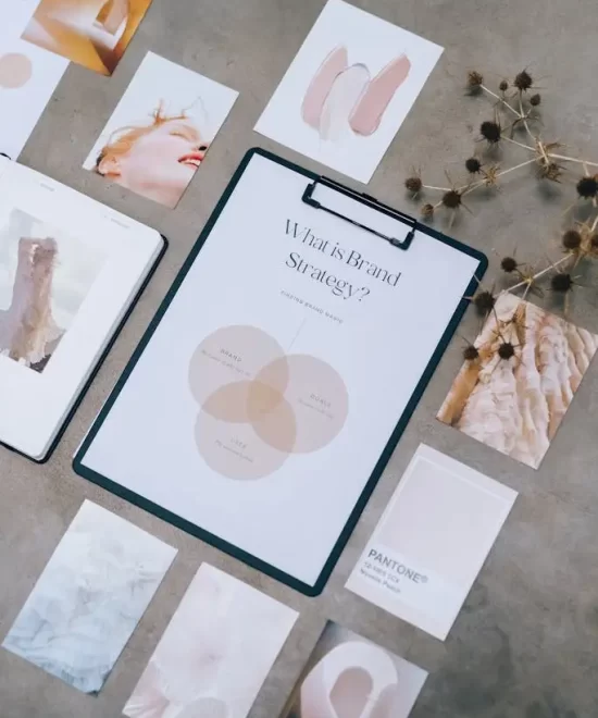 Laptop editing workspace with camera gear and memory cards, used by MRM Events for event media production.