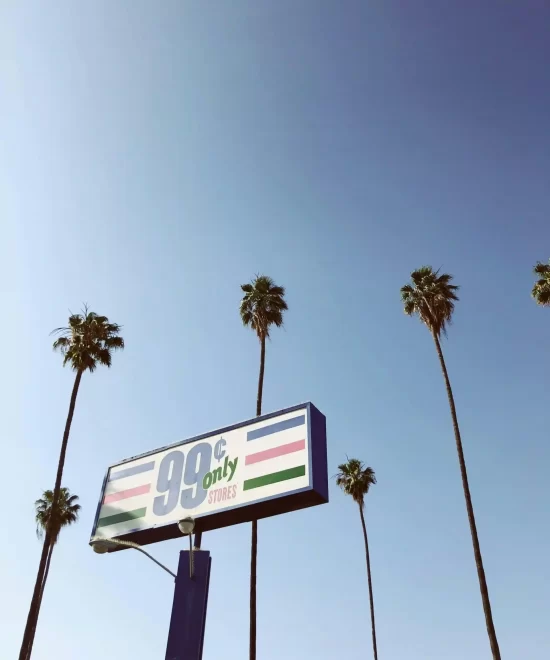 Signpost covered in snow with arrows pointing to various cities, symbolising worldwide reach and travel events managed by MRM Events.
