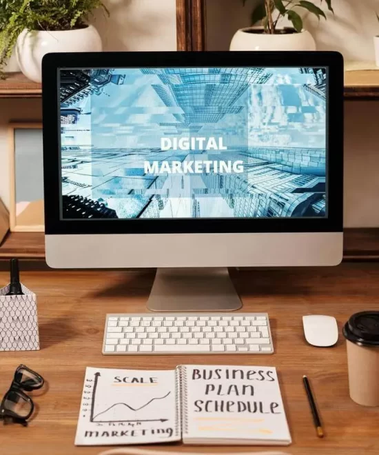 Computer screen showing a digital marketing dashboard and business plan notes, reflecting data-driven event marketing by MRM Events.